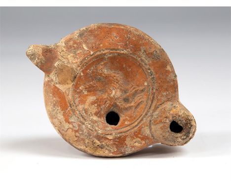 Roman cockerel oil lamp circa 2nd century AD. 

 Here we have a red slip pottery oil lamp decorated with a moulded figure of 