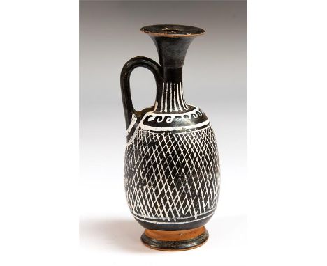 A pottery lekythos made in the Apulian, South Italian region. It is decorated with a white geometric net pattern. The body is
