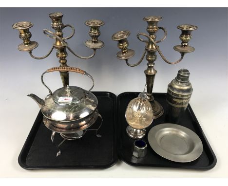 A pair of electroplate candelabra together with a spirit kettle and cocktail shaker etc