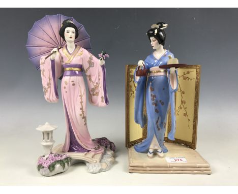 Two Japanese ceramic figurines modelled as Yoshiko and Tamiko