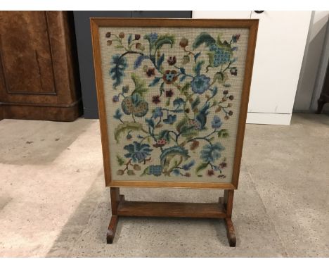 A convertible fire screen / tea table with gros point embroidery insert