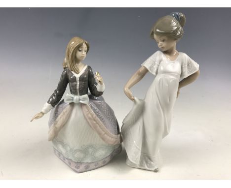 A Lladro figurine modelled as a girl, model 5211, together with a Nao figurine also modelled as a girl