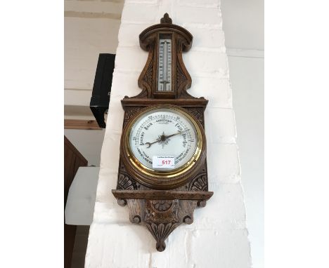 A Victorian carved oak banjo barometer