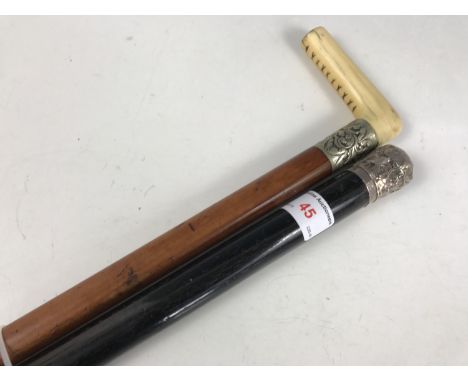 A Victorian walking cane with silver pommel together with a Victorian malacca stick with ivory handle