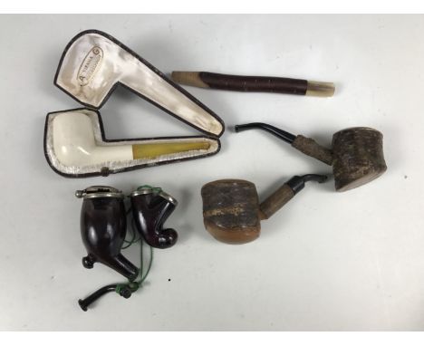 A cased Vienna meerschaum pipe together with others