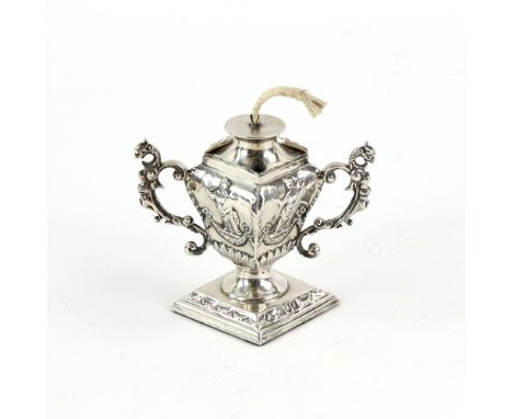 Victorian silver table lighter, of Neo-classical design with grotesque animals forming its handles, by William Comyns, London