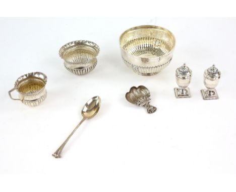 Group of silver items to include two bowls, a cream jug, a cased set of pepperettes a caddy spoon and another spoon, weighabl