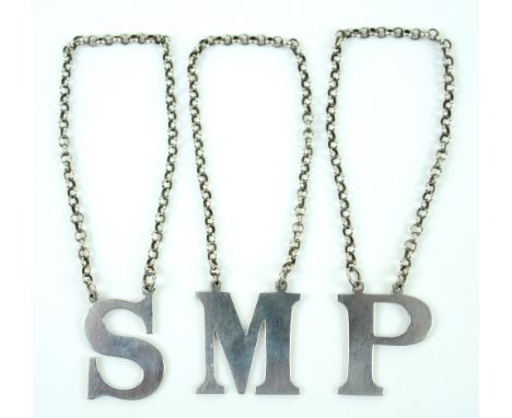 Victorian set of three silver decanter labels, in the form of letters P, M and S, by Rawlings and Simmons, London 1849, 3 cm 