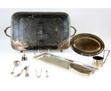 Selection of silver-plated items including a tea caddy, a pair of chambersticks, large toast rack, two trays, etc. .         
