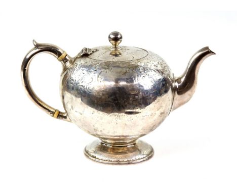 Scottish silver teapot, chased bulbous body,  and ivory insulators on the handle, on a circular pedestal foot, by James McKay