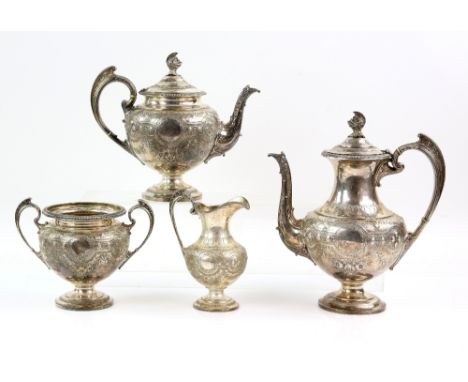 Victorian silver four piece tea service, comprising teapot, hot water jug, cream jug and sugar bowl, all with heavily engrave