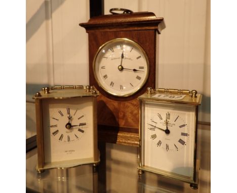 Pair of quartz carriage clocks and mahogany mantel clock with burr wood inlay
