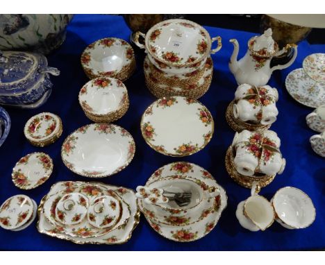 A Royal Albert Old Country Roses dinner service, including eight dinner, medium and side plates, soup and dessert bowls, cups