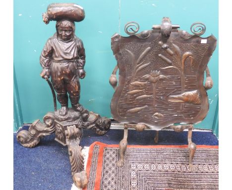 An Arts and Crafts wrought iron and copper fire screen decoratively embossed with fish, 74cm high x 50cm wide x 23cm deep and