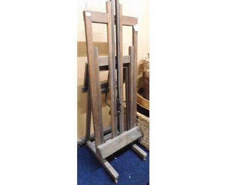An early 20th century beech framed adjustable free standing artists easel, 176cm high x 67cm wide x 67cm deep Condition Repor