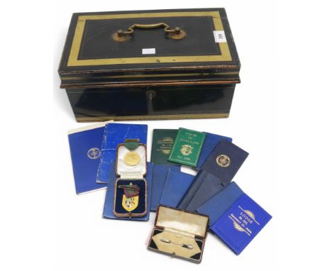 An early-20th century enamelled cash tin with Chubb's Patent lock, containing an assortment of Masonic ephemera, No. 1121 Cra