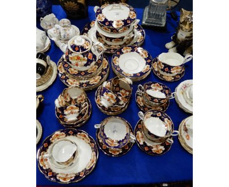 A Royal Albert Heirloom tea and dinner service including two oval platters, two tureens and lids, oval dish, six dinner and m