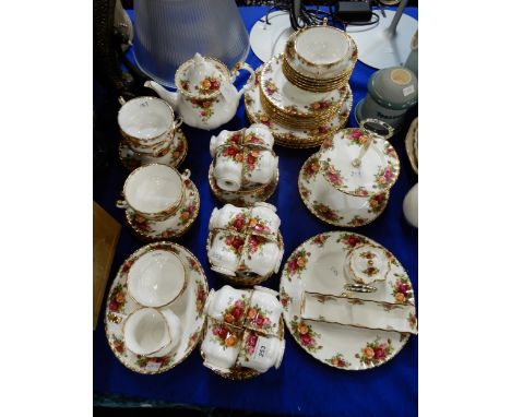 A Royal Albert Old Country Roses tea and dinner service comprising six dinner plates, eight medium plates, six bowls, two cak