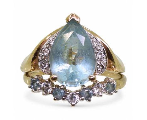 A pair of 9ct gold rings set with light blue topaz, clear gems and diamond accents, L and L1/2, weight 4.7gms Condition Repor