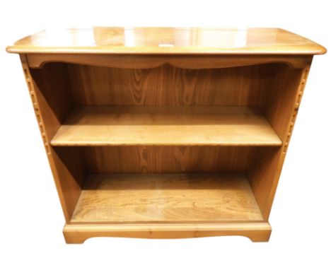 A 20th century elm and beech Ercol open bookcase with single adjustable shelf on bracket base, 83cm high x 92cm wide x 38cm d