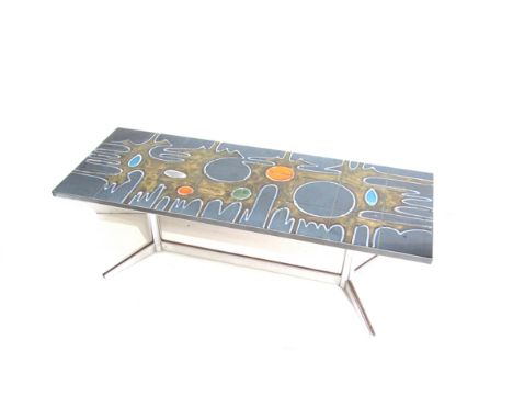 A chrome coffee table with Italian glazed tile top in the style of Poole Delphis.  122.5cm x 46cm x 40cm high