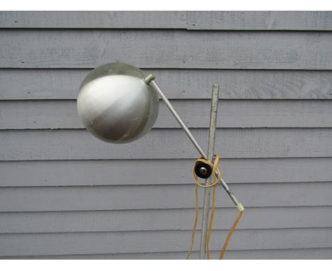 An aluminium finish standard lamp with single adjustable spot