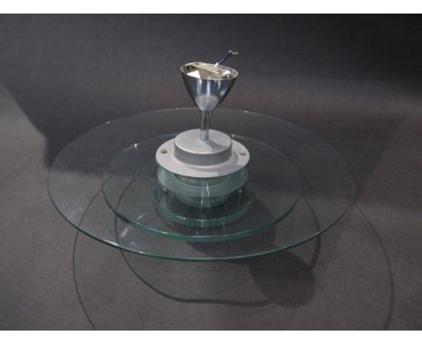 A glass ceiling light of circular panel layers in the Deco style.