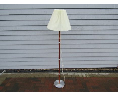 A Danish teak and aluminium standard lamp with pleated shade 
