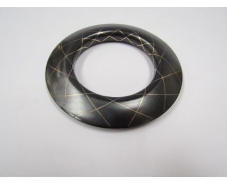 A metal bangle with niello line detail, signed Chartent ?