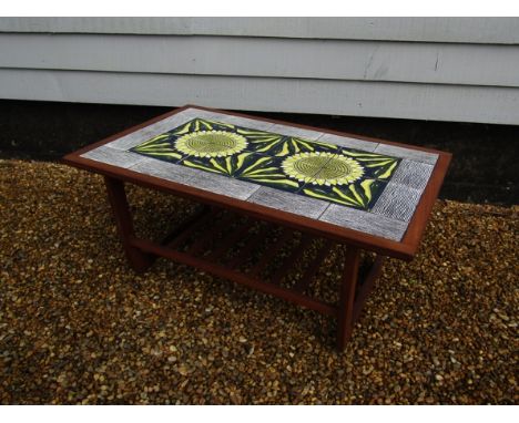A teak coffee table with inset tile panel top decorated with sunflower design 83cm x 52cm x 37cm 
