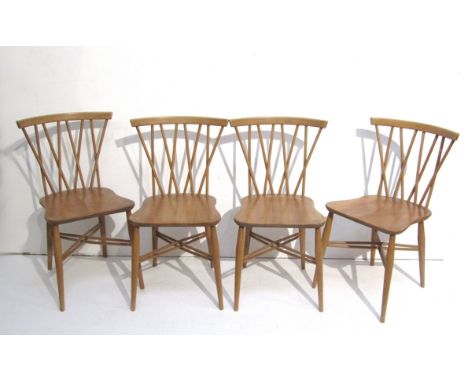 A set of four Ercol Chiltern Candlestick chairs with shaped seats in light elm and beech