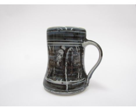 A Crowan Pottery (Harry &amp; May Davis) tankard.  13.5cm high