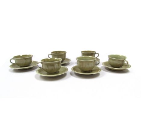 DAVID LEACH (1911-2005) A set of six porcelain tea cups with pale olive green glazed, fluted body, personal seals, together w