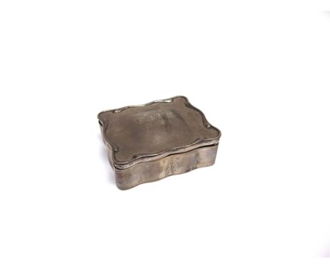 A SILVER TRINKET BOX marks rubbed, of rectangular shaped outline, the lined interior with fitting to take five rings, latter 