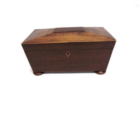A VICTORIAN TEA CADDY OF SARCOPHAGUS FORM  with ring handles, on compressed bun feet, 33cm wdie 16cm deep 17cm high