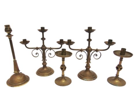 A GROUP OF ECCLESIASTICAL BRASS CANDLESTICKS  comprising a pair of three light candlesticks 31cm high, further pair with wide