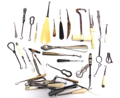 A COLLECTION OF VARIOUS METAL BUTTON HOOKS  including a boot pull with bone handle; and a combination button hook shoe horn