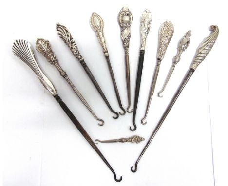 A COLLECTION OF TEN SILVER AND SILVER COLOURED BUTTON HOOKS 