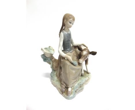 A LLADRO FIGURE 4813 'GIRL WITH CALF'  22cm high