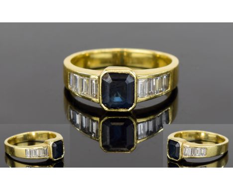 18ct Yellow Gold Baguette Diamond and Sapphire Ring. Marked 750 - 18ct. The Step-cut Sapphire of About 1ct. The Shoulders Set