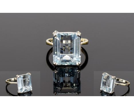 18ct Gold Set Single Step-cut Aquamarine Dress Ring. The Shank Marked 750, The Aquamarine of Good Colour and Clarity. Est Wei