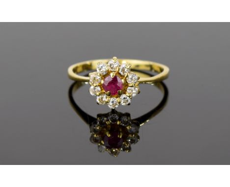 18K Antique Diamond Ruby Ring. A delicate flowerhead setting with central ruby surrounded by small diamonds