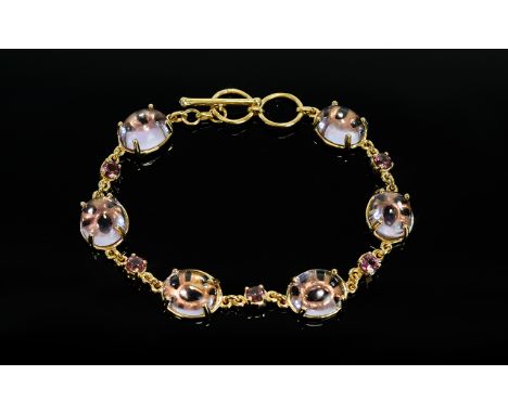 Rose de France Amethyst and Rhodolite Garnet Bracelet, six oval cabochons of the Rose de France amethyst, each set on an open