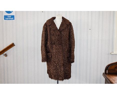 Astrakhan Vintage Coat Three quarter brown Persian lamb coat, front patch pockets, revere collar and covered button fastening