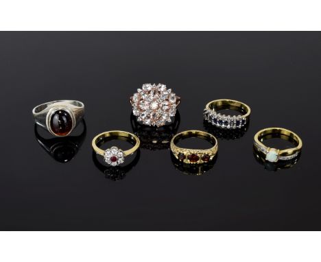 Six Silver Gemstone Rings To include silver tone and red cabochon ring, rose gold and crystal statement ring, gold tone and f