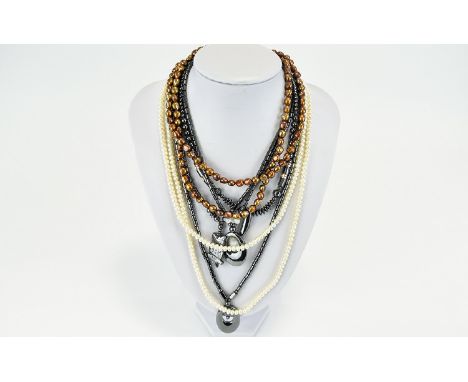 A Collection Of Contemporary Hematite Necklaces Six in total of varying lengths. To include bugle bead and circular statement