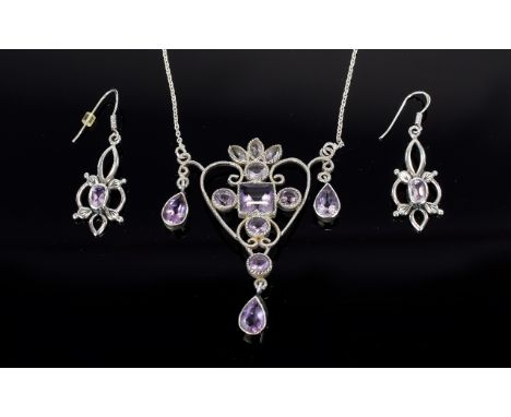 A Silver And Amethyst Set Art Nouveau Style Pendant And Earrings A delicate and intricate pendant in open heart shape with sc