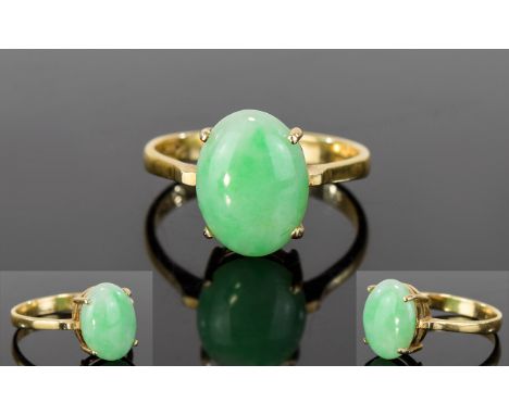 14ct Gold Set Single Stone Opal Dress Ring. The Large Oval Shaped Opal of Good Colour. Marked 585 - 14ct. Est 4 cts. 3.1 gram