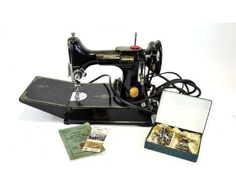 Antique Singer Portable Electric Sewing Machine Model 221K1 Rotary Hook Reverse Feed Finished in traditional black and gold, 