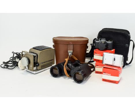 A Box Of Items. Comprises of a Slide Projector,  A Pentax auto 110 with case, A Samsung Camcorder, A TCM Camera with instruct